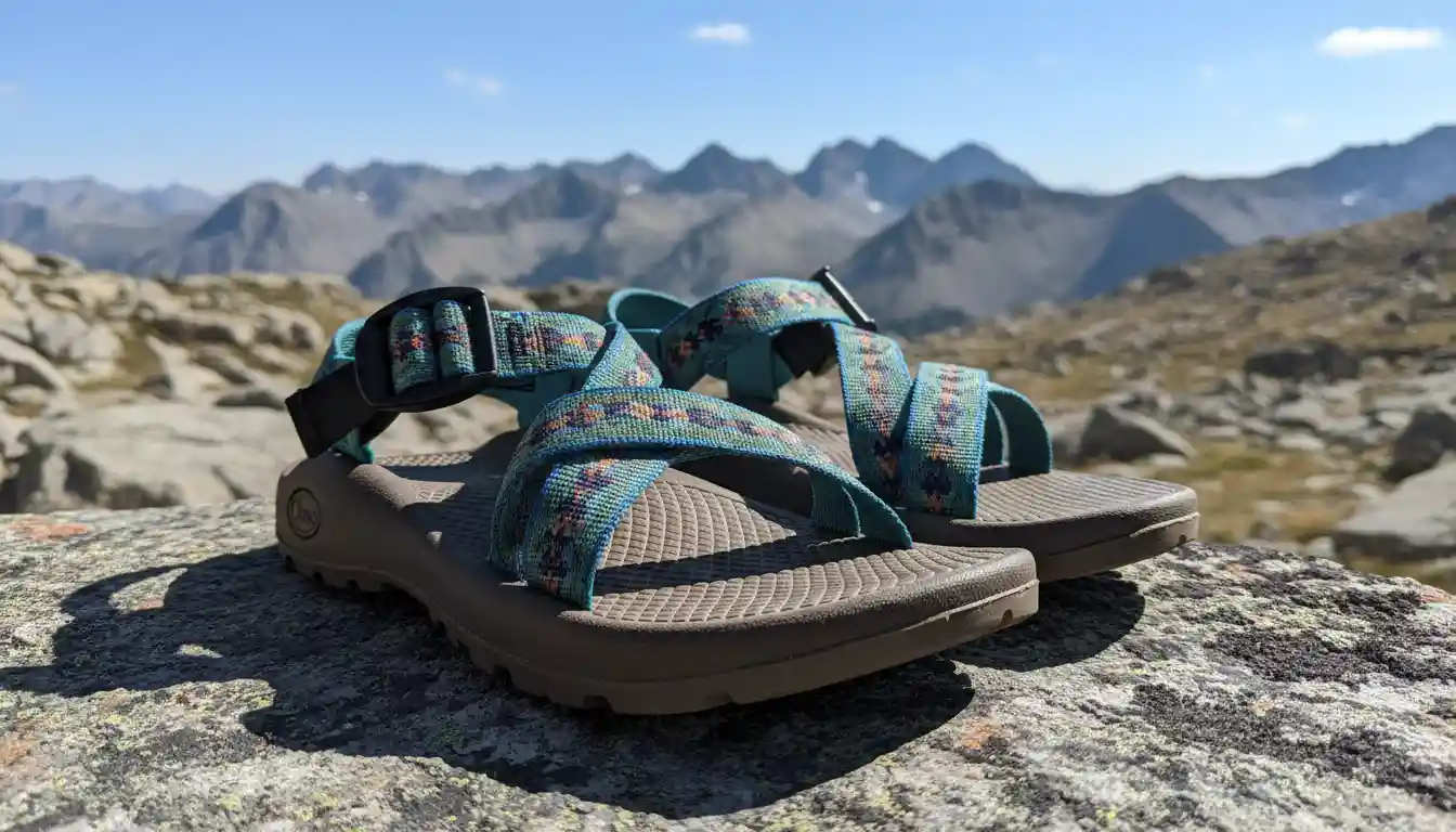 Pair of Chaco sandals on rocky terrain during a hike